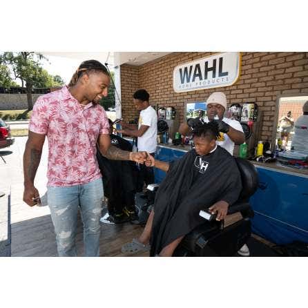 On Sunday, Sept. 8, 2024, the Wahl Mobile Barbershop gave Kansas City Public School students free haircuts, and Justin Reid did a special book reading. It was all to celebrate International Literacy Day and support the 'Books and Barbers' program, which p
